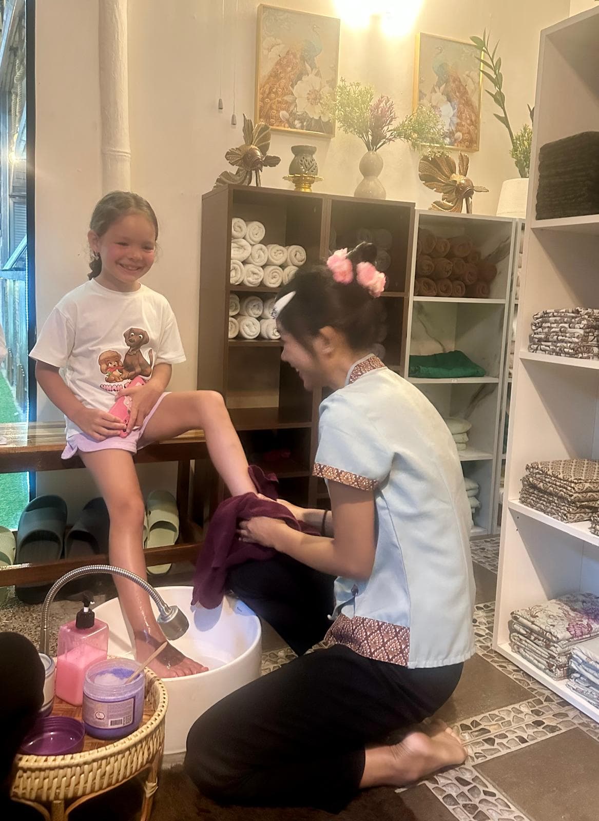 Child enjoying foot massage service