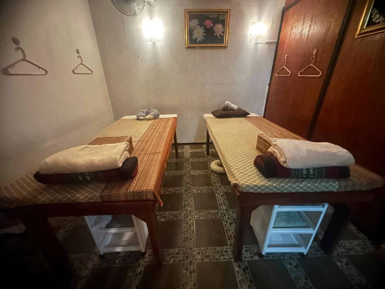 Couples massage room with professional setup