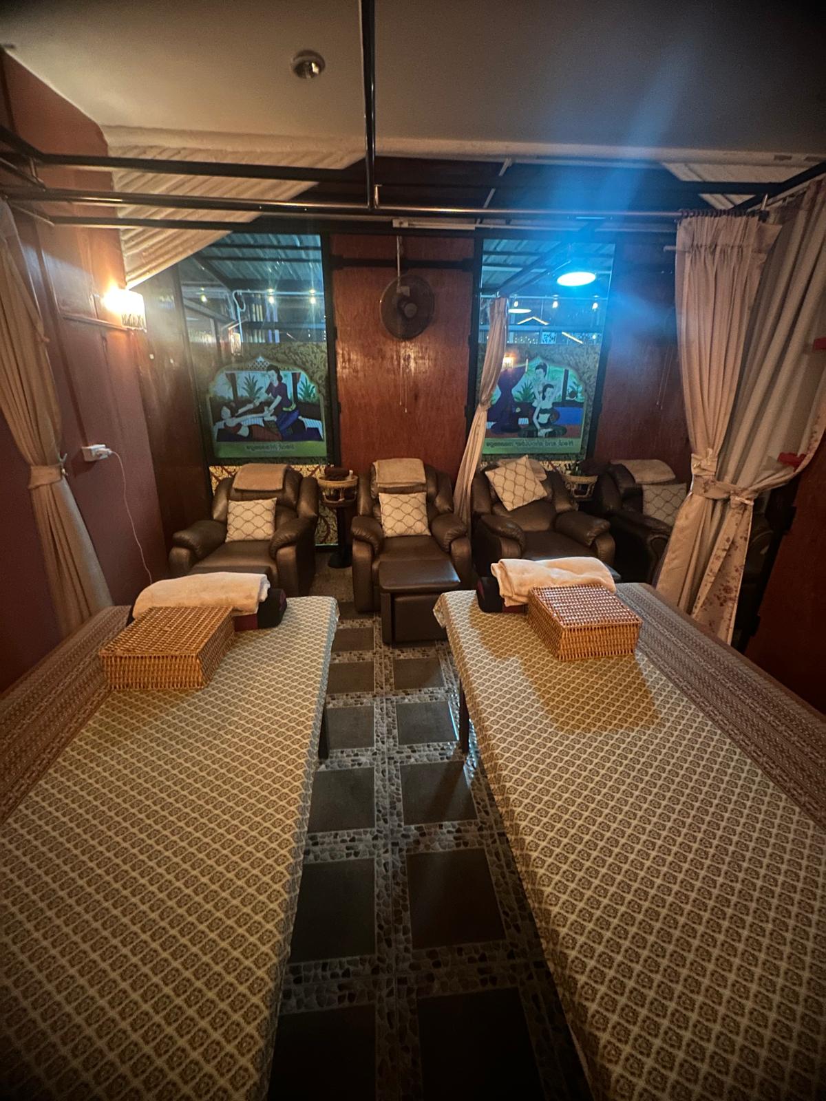 Couples room with massage beds and foot massage chairs