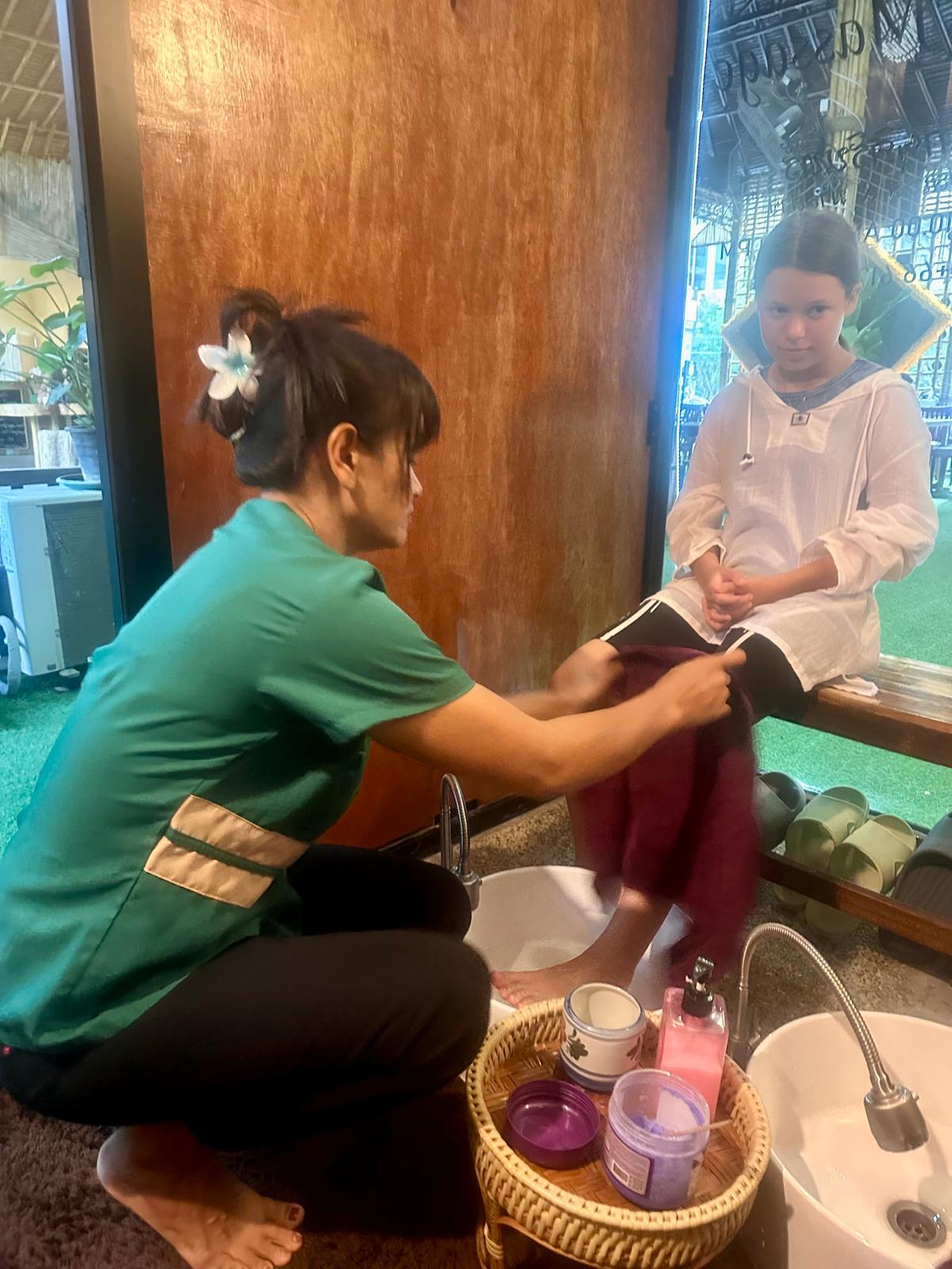 Therapist performing foot massage treatment