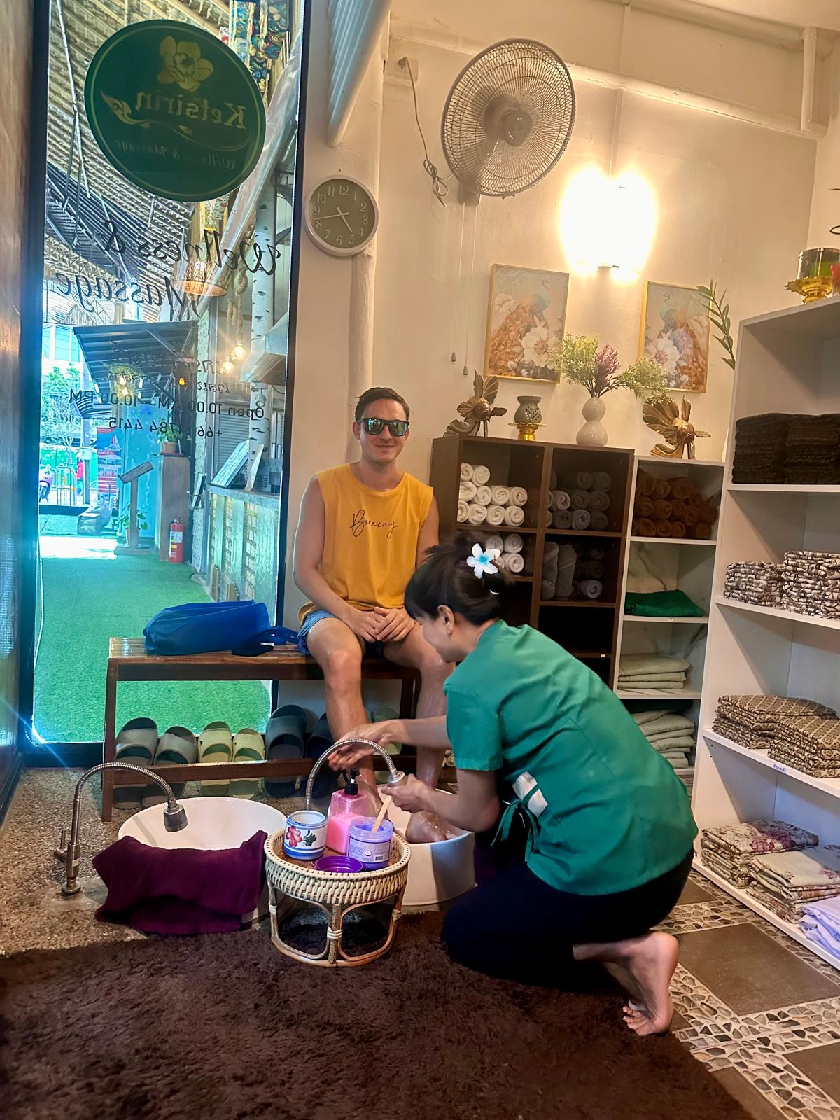 Male customer receiving foot massage