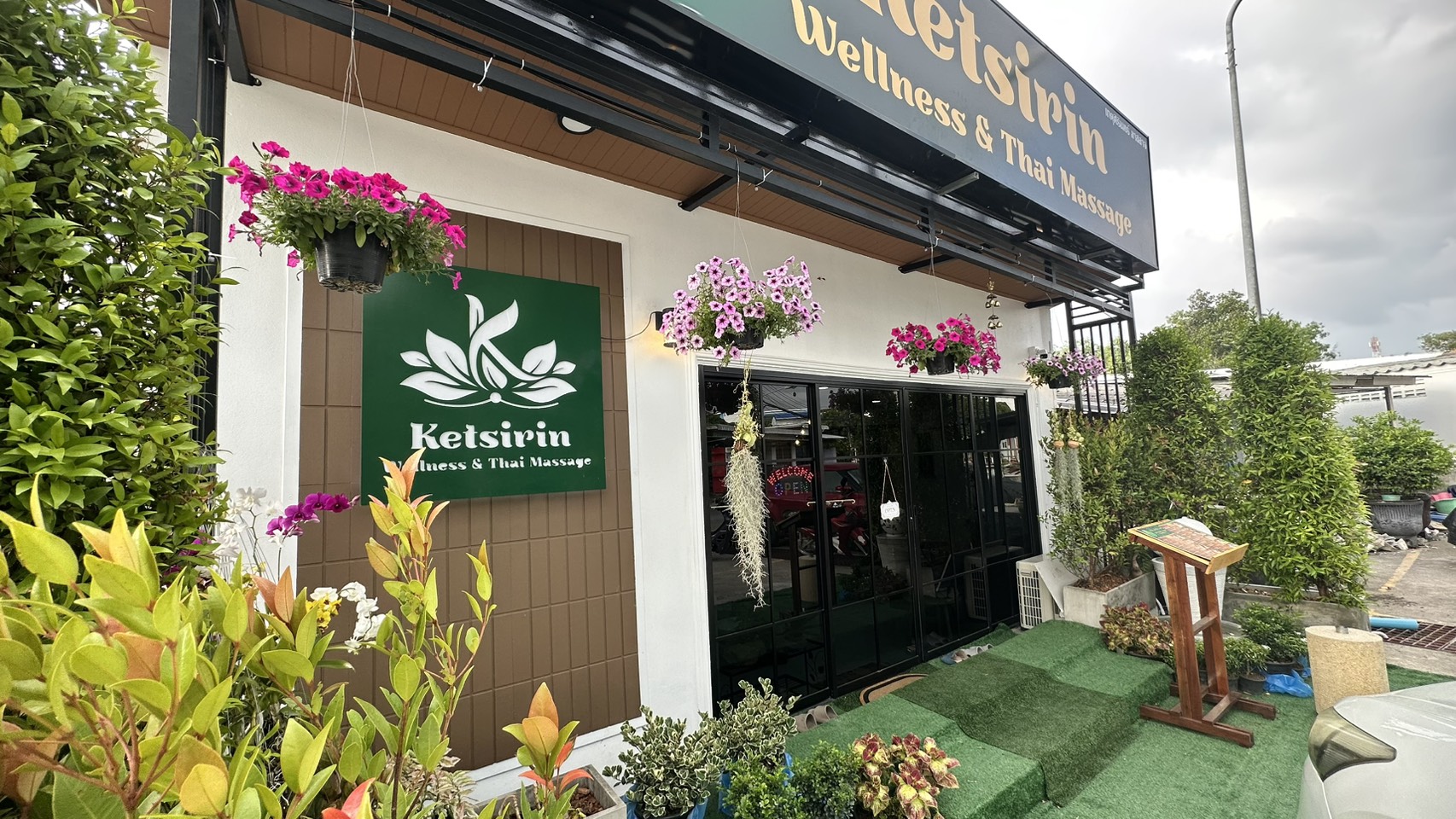 Ketsirin Cherngtalay exterior showing logo signboard, pink hanging flowers and welcoming entrance
