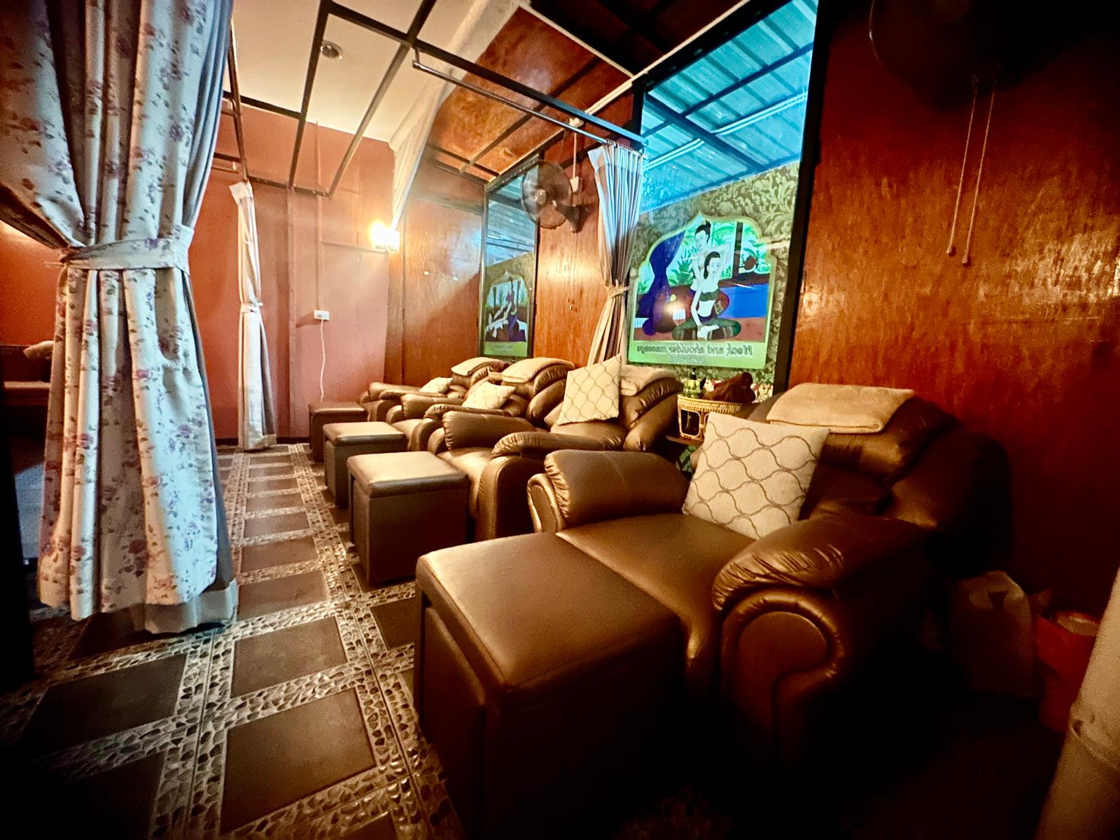 Foot massage lounge with leather recliners at Ketsirin Wellness Phuket