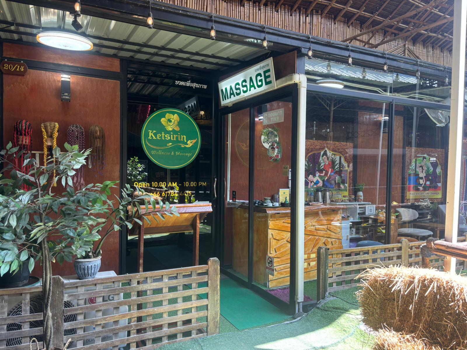 Ketsirin Wellness & Massage Bang Tao exterior entrance with logo signage and tropical plants